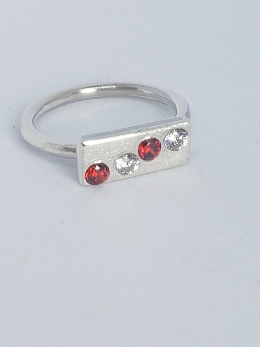 Sterling silver ring with red& clear cubic zirconia