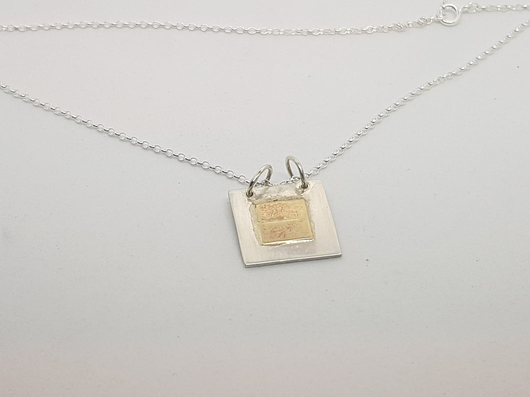 Sold!Sterling silver & 9ct gold square pendant