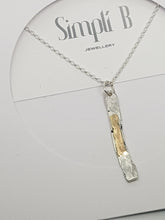 Sold!sterling silver & 9ct gold hammer textured pendant