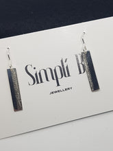 Sterling silver drop vertically textured earrings