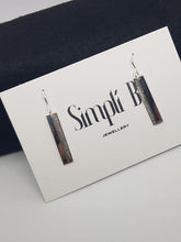 Sterling silver drop vertically textured earrings