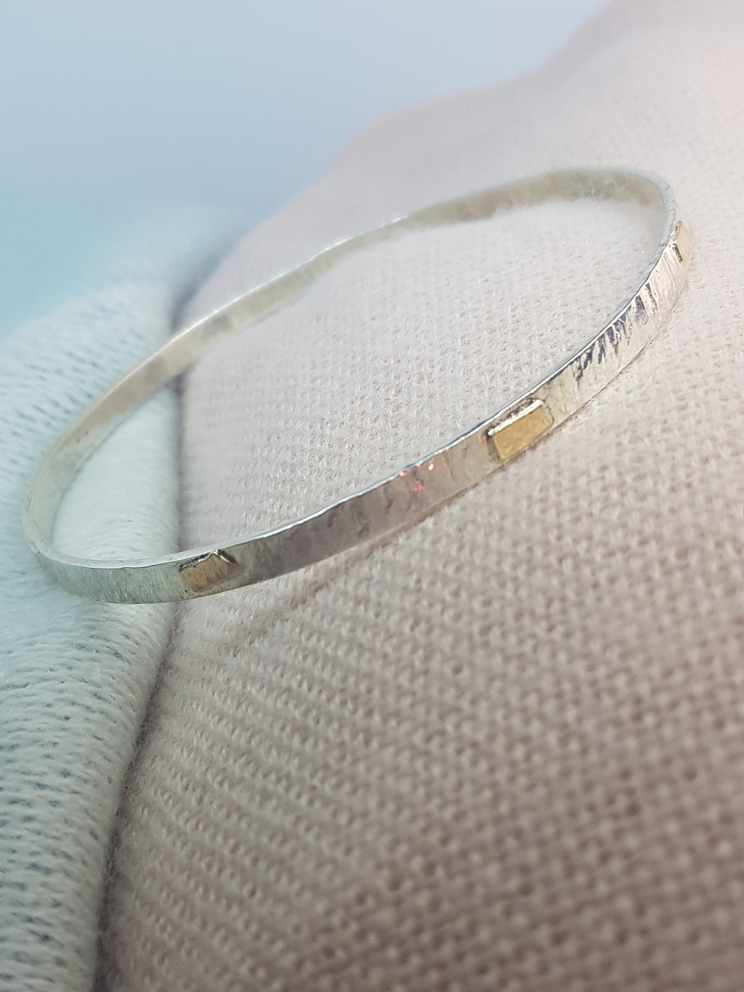 Sterling silver hammer textured bangle with 9ct gold accents