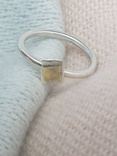 Sterling silver ring with a 9ct gold accent
