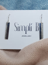 Sterling silver drop vertically textured earrings