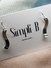 Sterling silver S shaped half hammer textured curved drop earrings