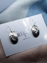 Sterling silver oval textured cut out half moon drop earrings