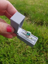 Sterling silver ring set with an emerald green cubic zirconia