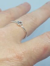 Sterling silver ring with a red cubic zirconia set in a cube