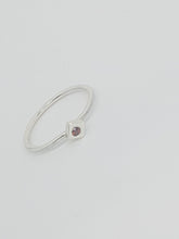 Sterling silver ring with a red cubic zirconia set in a cube